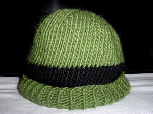 Green hat with a black stripe and ribbed cuff