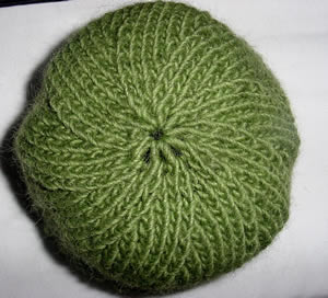 Top of green hat with black stripe and ribbed cuff