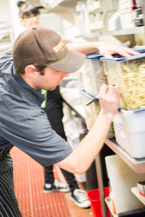 Labeling french fries before the head back down to the cooler