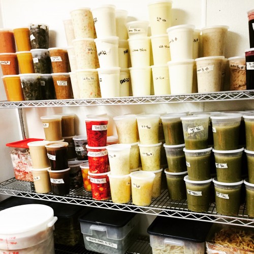 Sauces lined up in the cooler waiting to make someone's meal perfect